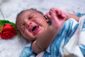 baby with colic crying