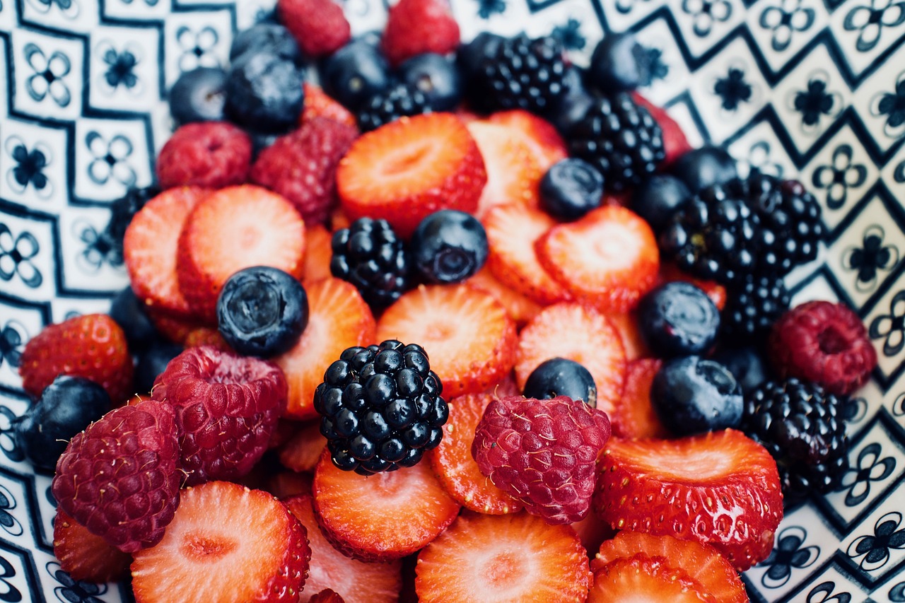 A bowl of fruit: strawberries, blueberries, raspberries