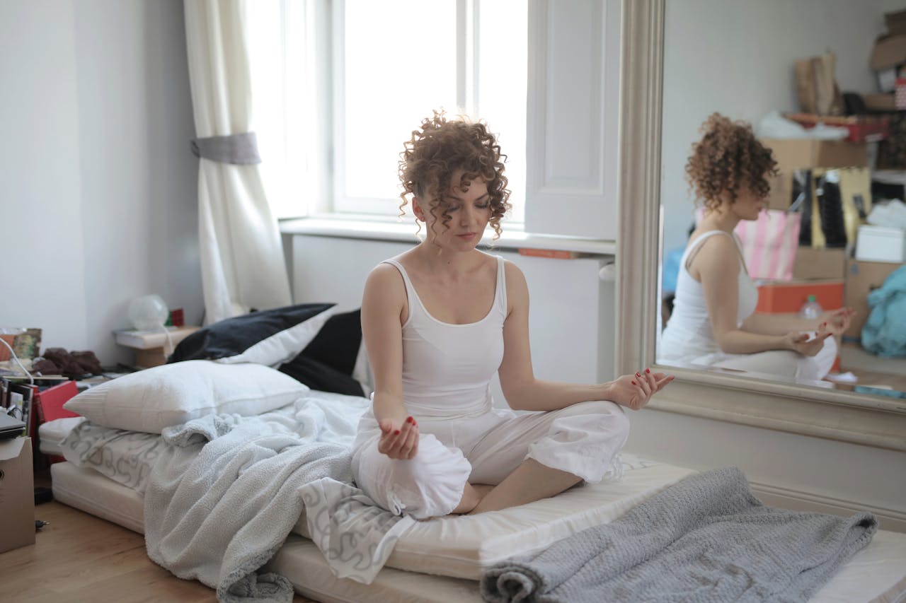 Woman sitting on floor mediating