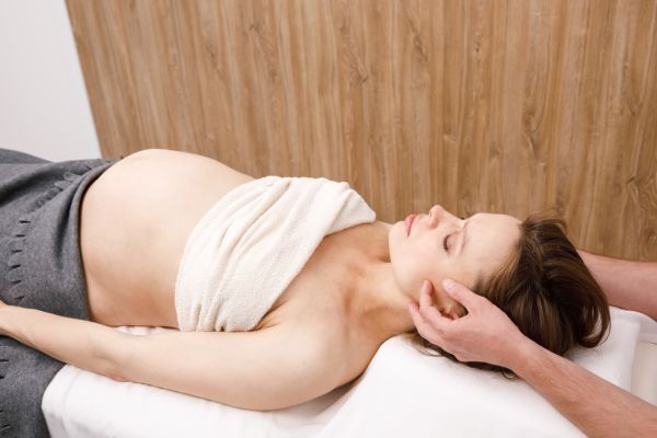 Pregnant woman getting an adjustment